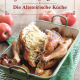 Cover des Buches 'Grabnerhof Kochbuch' mit einem gefüllten Backhendl im Backblech, dahinter rote Äpfel