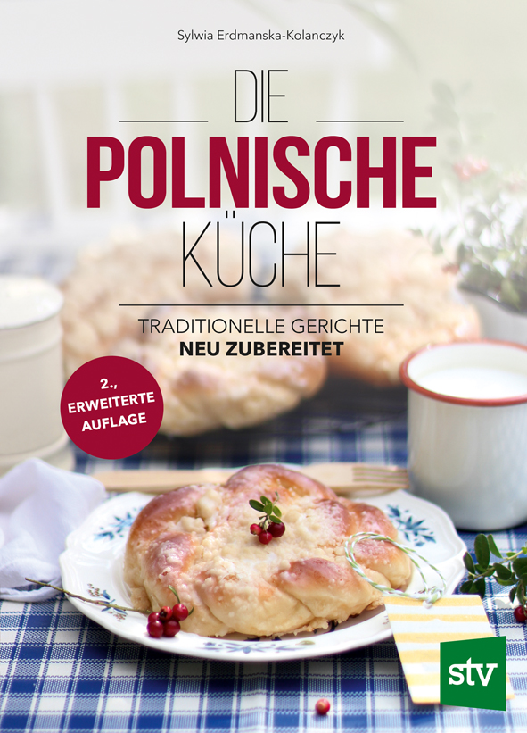Cover des Buches 'Die polnische Küche' mit polnischer Süßspeise auf einem gedeckten Tisch.