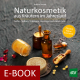 Cover des E-Books 'Naturkosmetik aus Kräutern im Jahreslauf' mit verschiedenen Utensilien, u.a. Fläschchen und Tiegel, für die Herstellung von Naturkosmetik