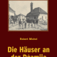 Cover des Buches 'Die Häuser an der Dzamija' mit einer alten schwarz-weiß Aufnahme mehrerer Häuser und davor Menschen