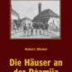 Cover des E-Books 'Die Häuser an der Dzamija' mit einer alten schwarz-weiß Aufnahme mehrerer Häuser und davor Menschen