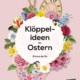 Cover des Buches 'Klöppelideen für Ostern' mit gezeichneten Blumen und zwei Klöppelarbeiten rund um den Titel auf rosa Hintergrund
