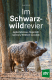 Cover des Buches 'Im Schwarzwildrevier' mit Wildschwein zwischen Bäumen