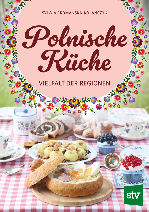 Cover des Buches 'Polnische Küche - Vielfalt der Regionen' mit gedecktem Tisch und verschiedenen polnischen Gerichten